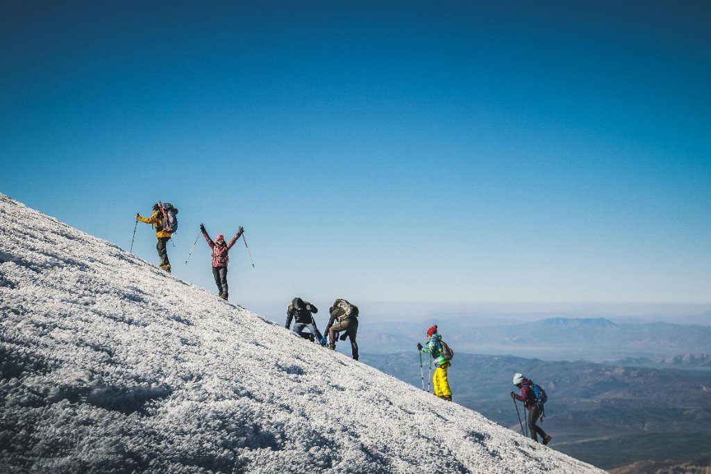 Trekkers on a snow-covered Kilimanjaro ridge on the Machame route